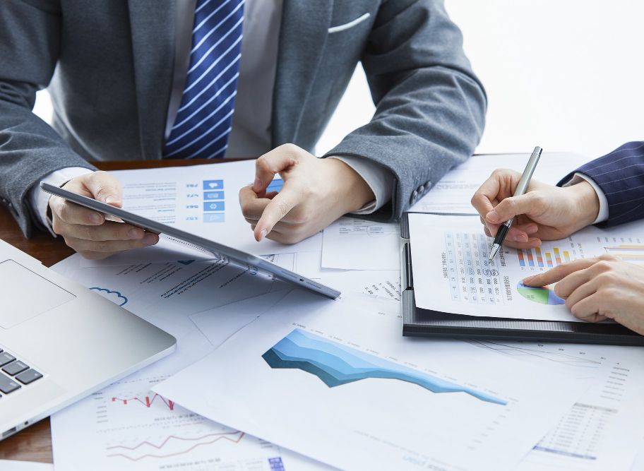businessmen-elegant-suits-business-meeting-discussing-new-project-office